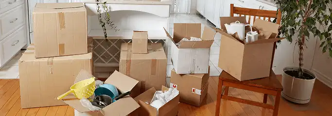 Packed moving boxes and household items in a kitchen before move-out or move-in cleaning, Green Bay, WI.
